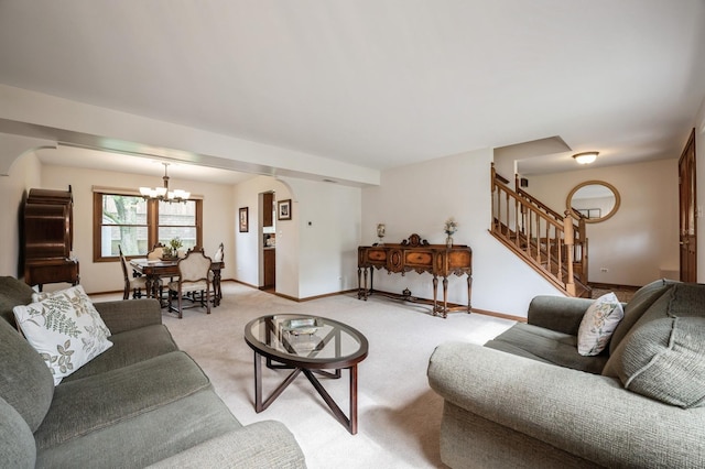 872 Asbury Ln, Schaumburg, IL 60193 - living room with a chandelier, arched walkways, stairway, and light colored carpet
