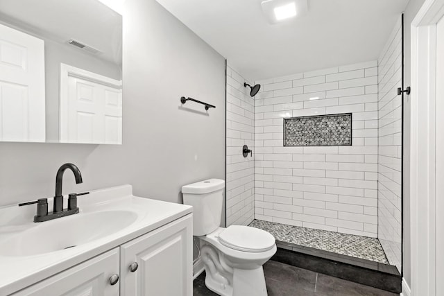 293 Hickory St, Chicago Heights, IL 60411 - bathroom with vanity, tiled shower, and tile patterned flooring