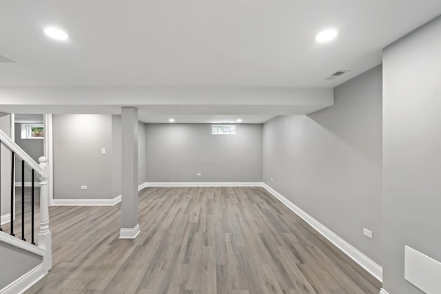 293 Hickory St, Chicago Heights, IL 60411 - below grade area featuring wood finished floors, stairs, and recessed lighting
