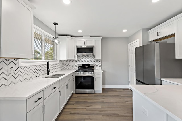 293 Hickory St, Chicago Heights, IL 60411 - kitchen with appliances with stainless steel finishes, white cabinets, dark wood finished floors, recessed lighting, and tasteful backsplash