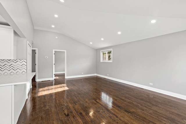 293 Hickory St, Chicago Heights, IL 60411 - unfurnished living room with vaulted ceiling, dark wood-style floors, and recessed lighting