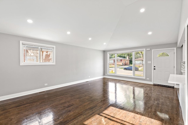 293 Hickory St, Chicago Heights, IL 60411 - unfurnished living room featuring vaulted ceiling, wood finished floors, and recessed lighting
