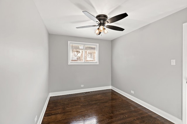 293 Hickory St, Chicago Heights, IL 60411 - spare room featuring dark wood-type flooring and a ceiling fan