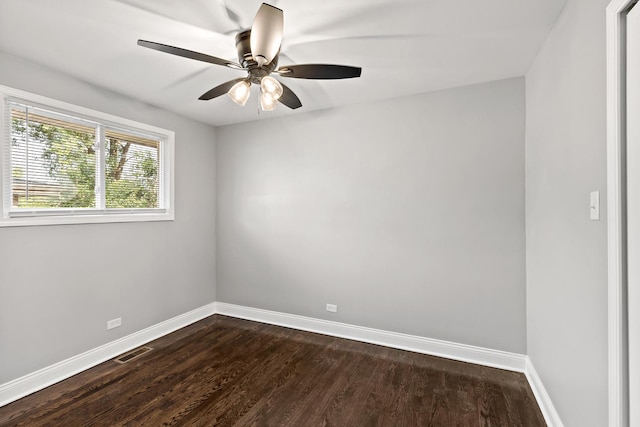 293 Hickory St, Chicago Heights, IL 60411 - spare room with dark wood-type flooring and a ceiling fan