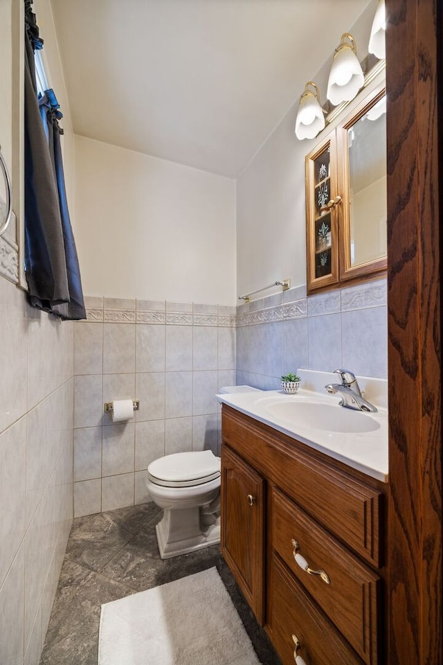 267 N Idlewild Ave, Mundelein, IL 60060 - bathroom with vanity, tile walls, and a wainscoted wall