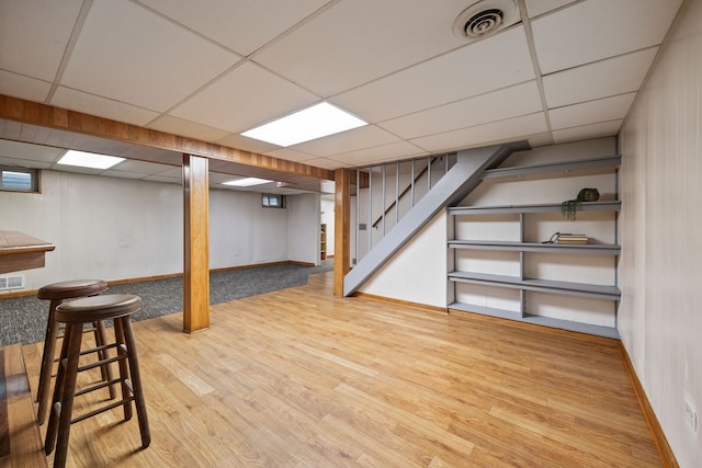 267 N Idlewild Ave, Mundelein, IL 60060 - finished basement with a paneled ceiling, wood finished floors, and stairs
