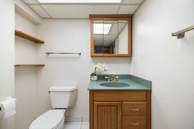 267 N Idlewild Ave, Mundelein, IL 60060 - half bath with vanity, tile patterned floors, and a paneled ceiling