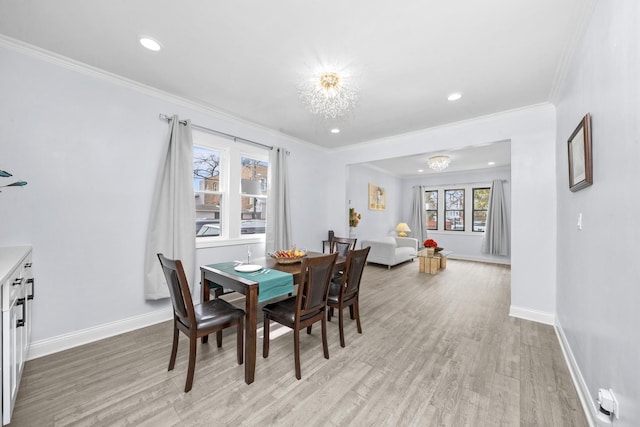 3039 S Kolin Ave, Chicago, IL 60623 - dining space featuring light wood-style floors, a chandelier, crown molding, and recessed lighting