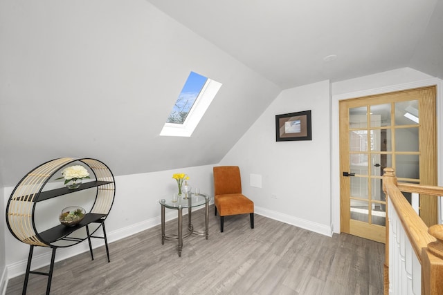 3039 S Kolin Ave, Chicago, IL 60623 - living area featuring a skylight, lofted ceiling, and wood finished floors