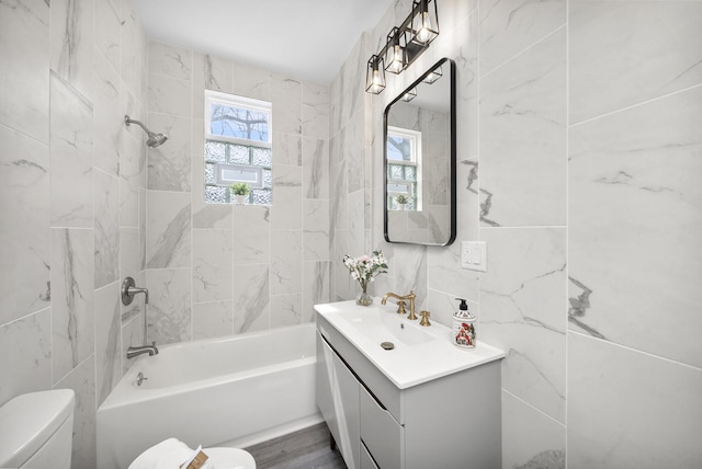 3039 S Kolin Ave, Chicago, IL 60623 - bathroom featuring vanity, shower / bath combination, and tile walls