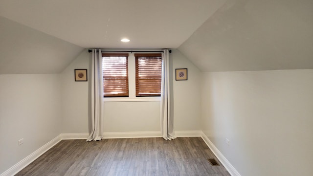 3039 S Kolin Ave, Chicago, IL 60623 - additional living space featuring dark wood-style floors and vaulted ceiling