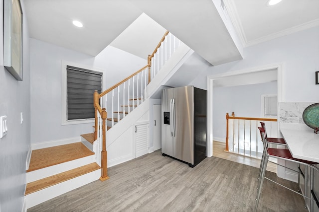 3039 S Kolin Ave, Chicago, IL 60623 - staircase featuring wood finished floors, ornamental molding, and recessed lighting