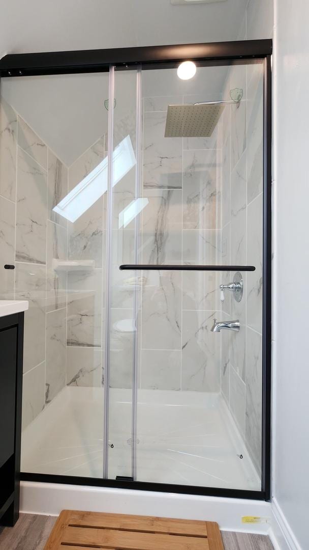 3039 S Kolin Ave, Chicago, IL 60623 - full bathroom with a shower stall, wood finished floors, and vanity