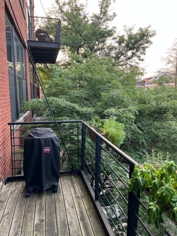 2210 W Wabansia Ave Unit 302, Chicago, IL 60647 - wooden deck featuring area for grilling