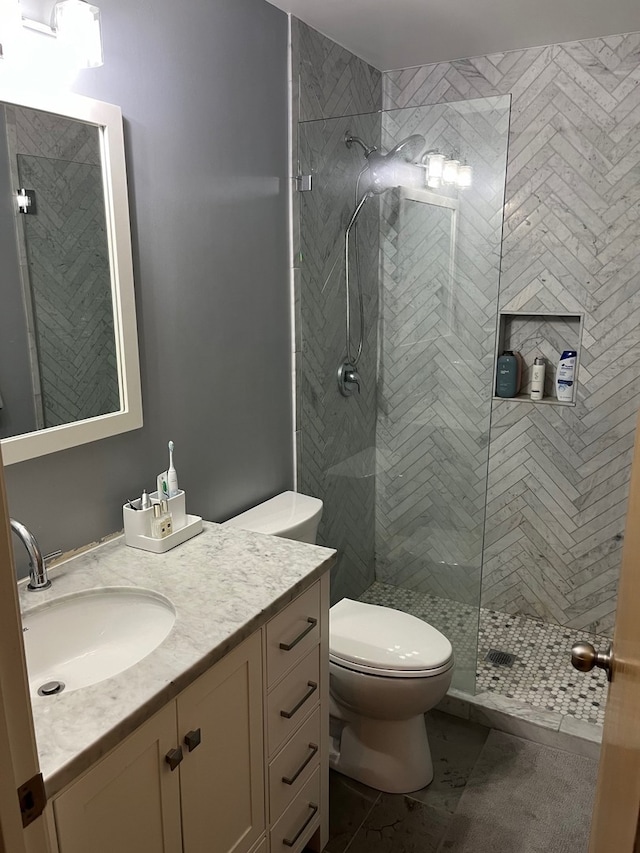 2210 W Wabansia Ave Unit 302, Chicago, IL 60647 - full bath featuring vanity, a tile shower, and tile patterned floors