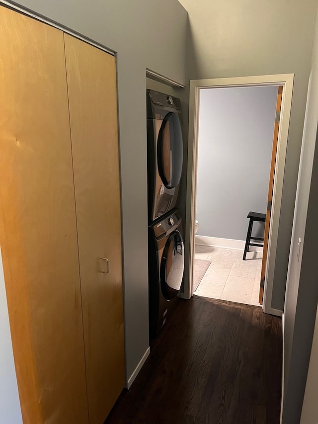 2210 W Wabansia Ave Unit 302, Chicago, IL 60647 - laundry room with stacked washer and clothes dryer and dark wood-type flooring