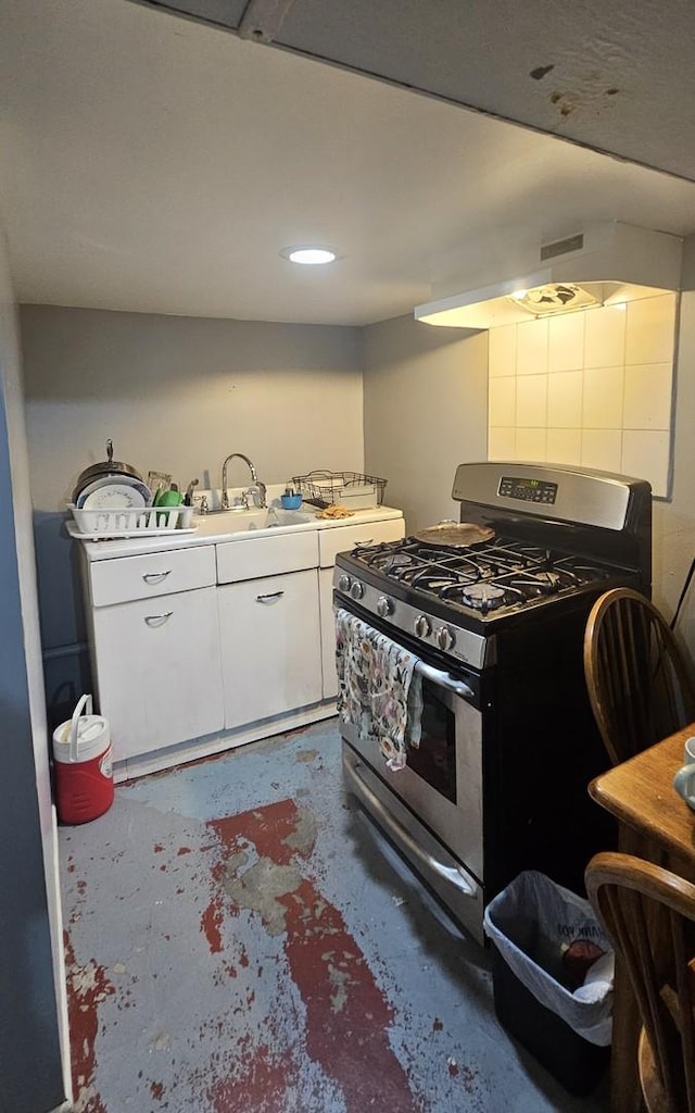 5330 S California Ave, Chicago, IL 60632 - kitchen featuring stainless steel gas range, concrete flooring, and white cabinetry