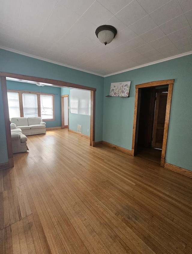 5330 S California Ave, Chicago, IL 60632 - unfurnished living room with crown molding and wood finished floors