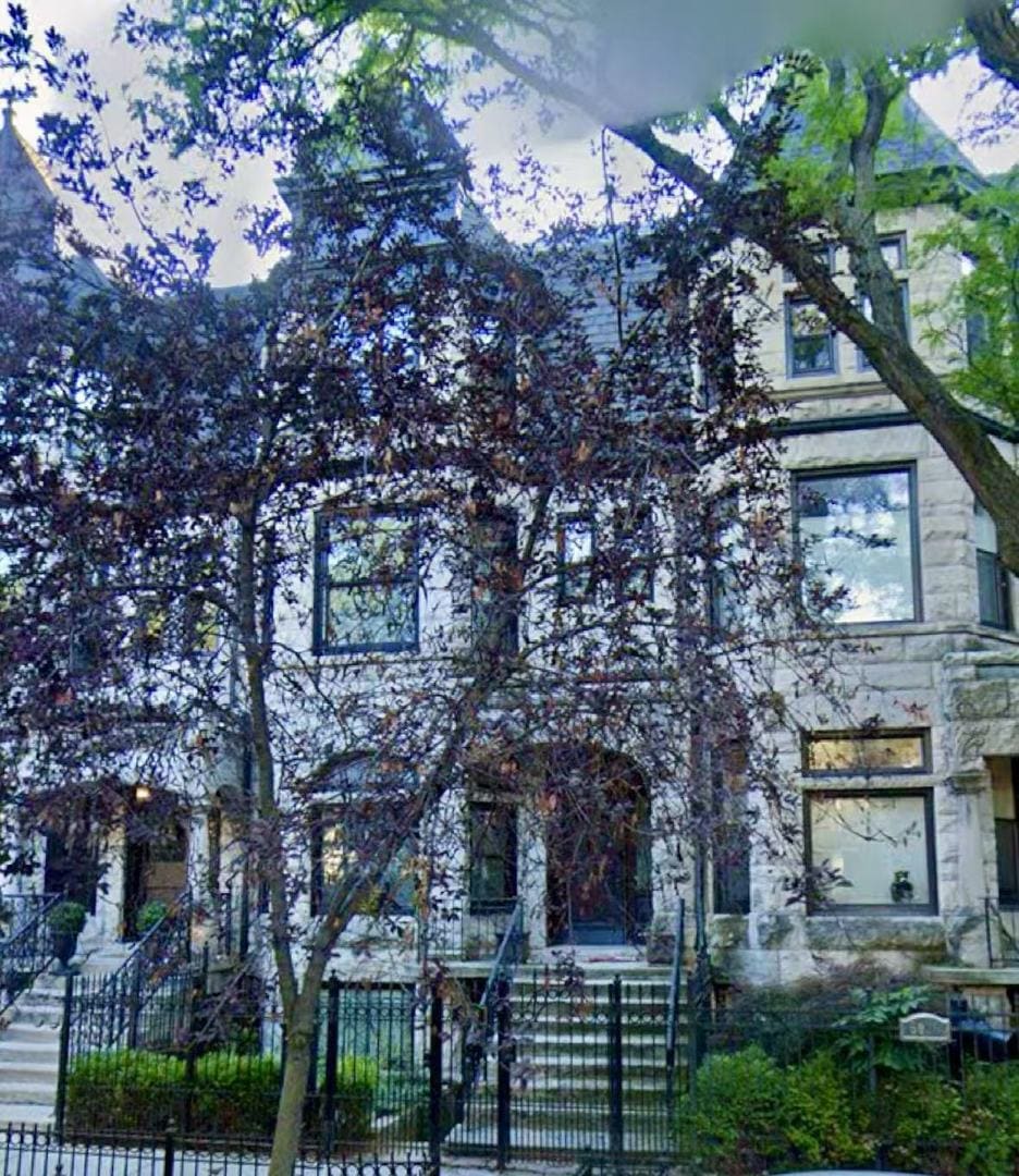 5028 S Blackstone Ave, Chicago, IL 60615 - view of property hidden behind natural elements featuring a fenced front yard
