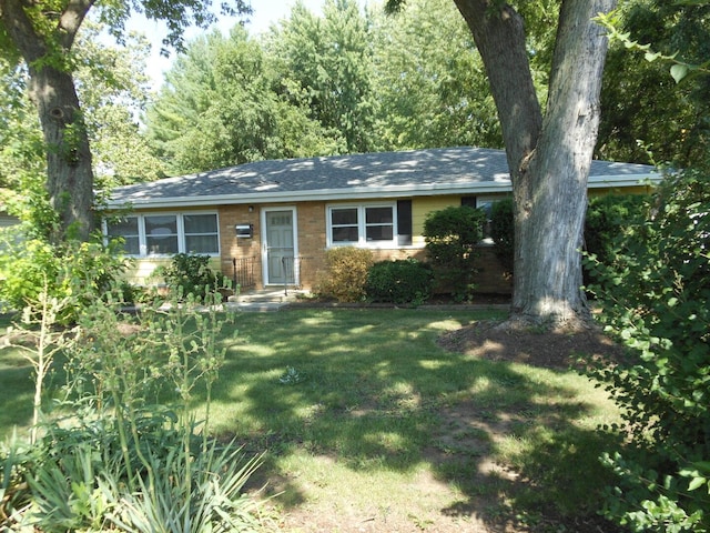15409 S Union Pl, Plainfield, IL 60544 - ranch-style home featuring a front yard, roof with shingles, and brick siding