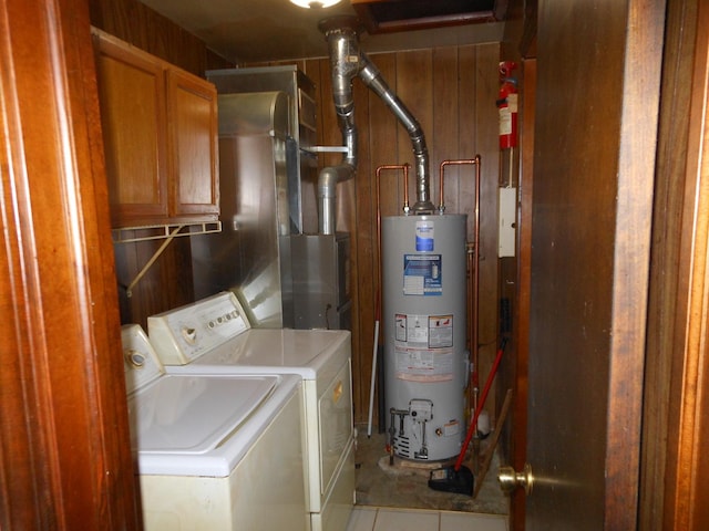 15409 S Union Pl, Plainfield, IL 60544 - laundry area featuring cabinet space, washer and dryer, water heater, and tile patterned flooring