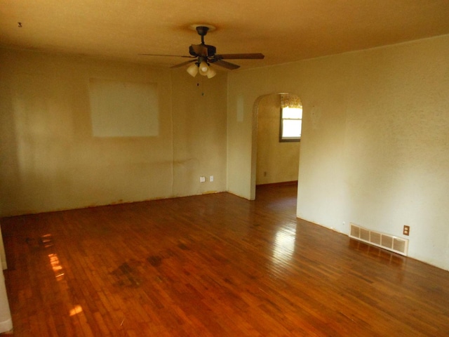 15409 S Union Pl, Plainfield, IL 60544 - unfurnished room with arched walkways, wood finished floors, and ceiling fan