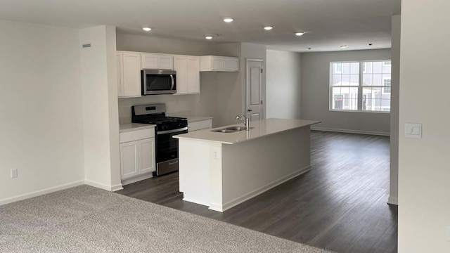 6550 Linden Trl Unit E, Wonder Lake, IL 60097 - kitchen with appliances with stainless steel finishes, white cabinets, a center island with sink, recessed lighting, and light countertops