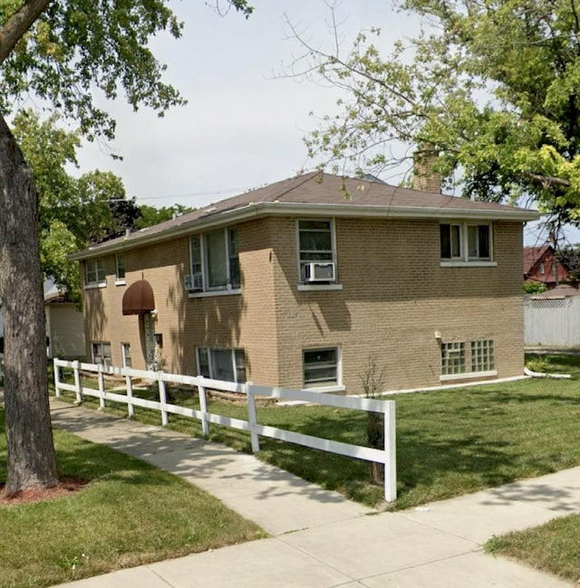 220 S 9th Ave, Maywood, IL 60153 - rear view of house featuring brick siding and a chimney