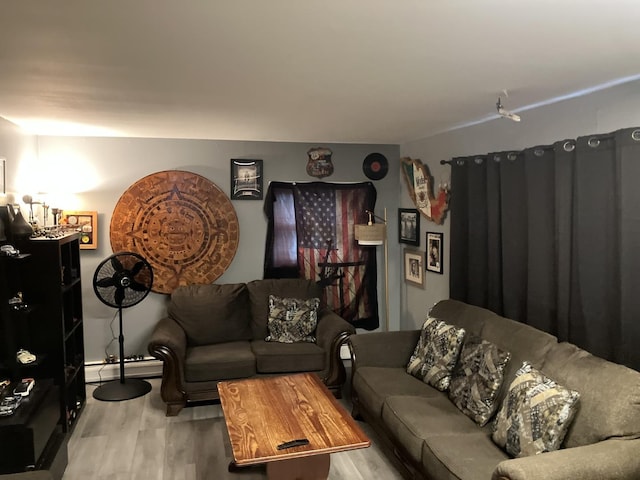 220 S 9th Ave, Maywood, IL 60153 - living room with wood finished floors and a baseboard heating unit