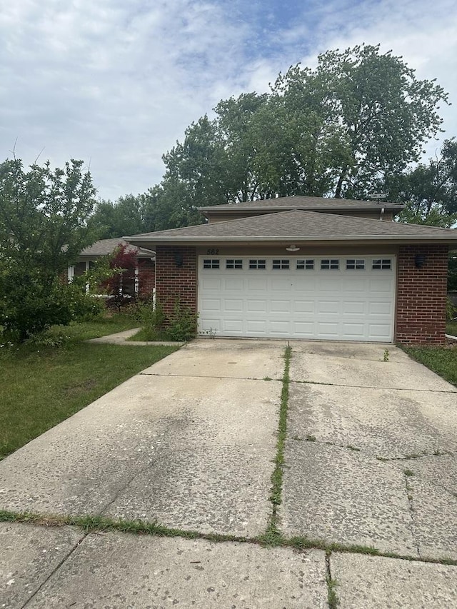 562 Willow Rd, Matteson, IL 60443 - view of front facade with an attached garage, brick siding, and concrete driveway