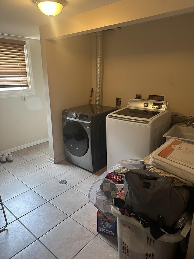562 Willow Rd, Matteson, IL 60443 - washroom featuring washing machine and dryer and light tile patterned floors