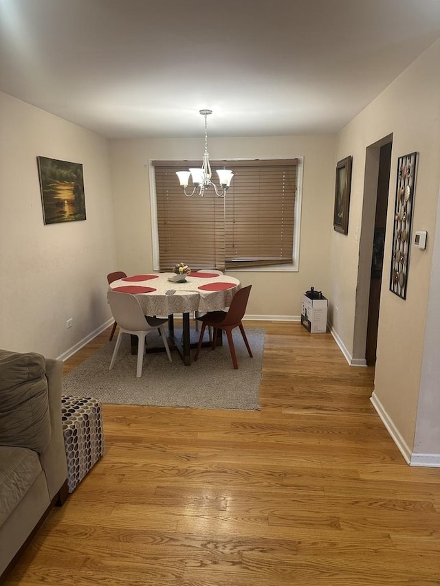 562 Willow Rd, Matteson, IL 60443 - dining area featuring a chandelier and light wood-type flooring
