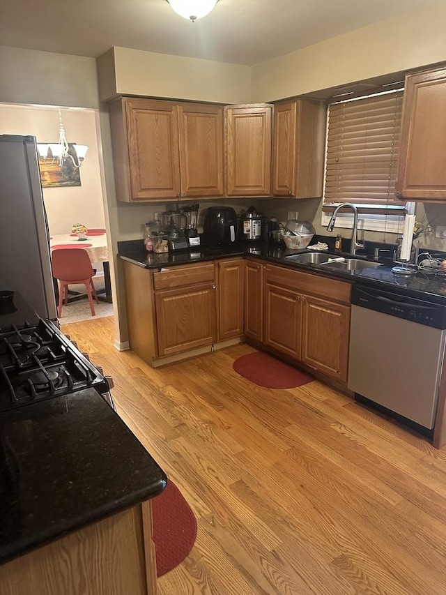 562 Willow Rd, Matteson, IL 60443 - kitchen featuring stainless steel appliances, light wood finished floors, and brown cabinetry