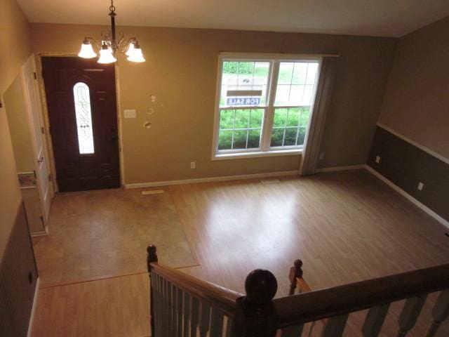 316 Brookwood Trl, Mchenry, IL 60050 - entryway with wood finished floors, plenty of natural light, and a chandelier