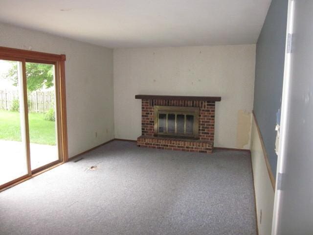 316 Brookwood Trl, Mchenry, IL 60050 - unfurnished living room with carpet and a fireplace