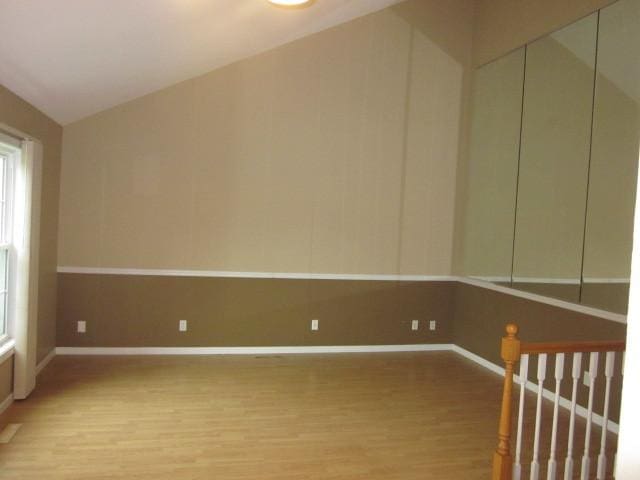 316 Brookwood Trl, Mchenry, IL 60050 - spare room with light wood-style flooring, vaulted ceiling, and plenty of natural light