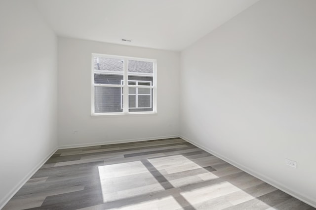 14628 S Azalia Cir, Plainfield, IL 60544 - spare room with wood finished floors and baseboards