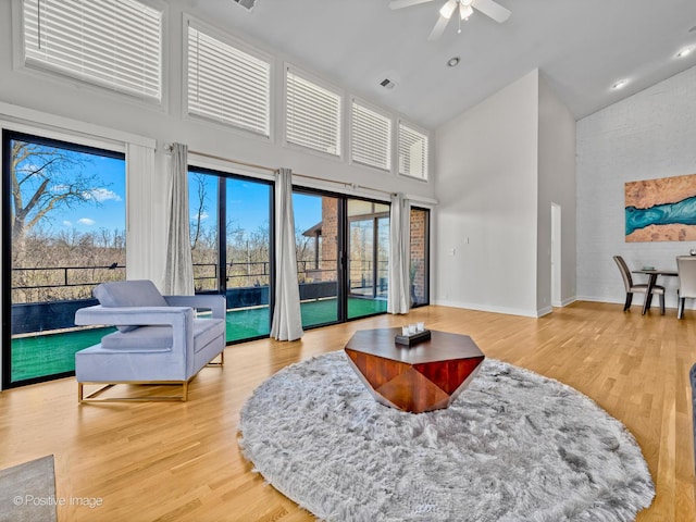 1039 Deerfield Pl Unit 1039, Highland Park, IL 60035 - living area featuring high vaulted ceiling, a ceiling fan, and wood finished floors