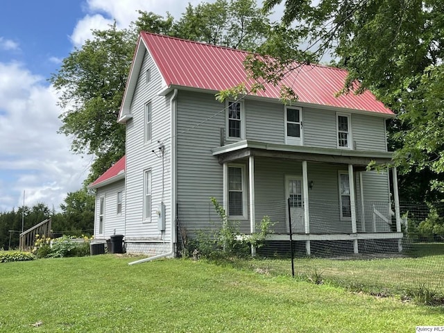 1550 N 2753rd Ln, Loraine, IL 62349 - view of front facade with a porch, a front lawn, and a metal roof