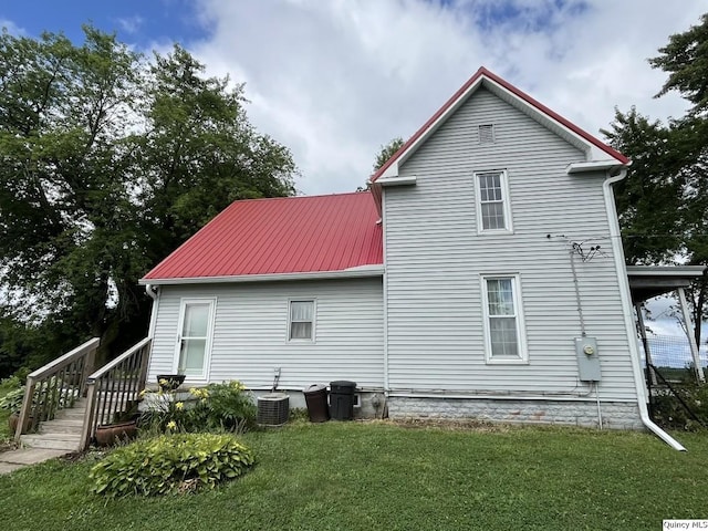 1550 N 2753rd Ln, Loraine, IL 62349 - back of house with a lawn and a metal roof