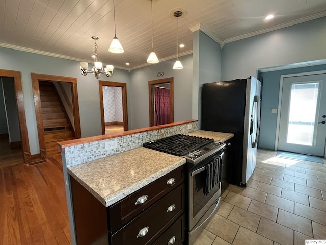 1550 N 2753rd Ln, Loraine, IL 62349 - kitchen featuring stainless steel appliances, a chandelier, hanging light fixtures, ornamental molding, and dark brown cabinetry