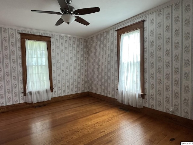 1550 N 2753rd Ln, Loraine, IL 62349 - unfurnished room with hardwood / wood-style flooring and a ceiling fan
