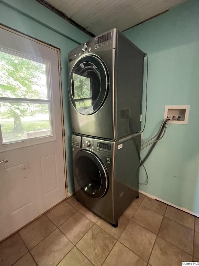 1550 N 2753rd Ln, Loraine, IL 62349 - washroom featuring stacked washer / drying machine and light tile patterned floors