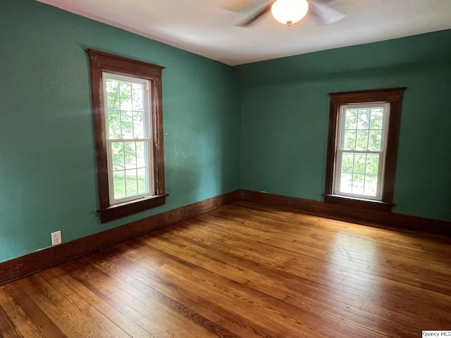 1550 N 2753rd Ln, Loraine, IL 62349 - spare room with healthy amount of natural light, ceiling fan, and wood-type flooring