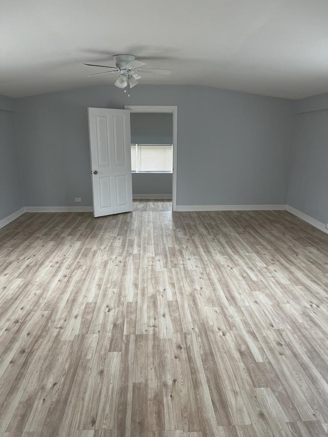 7535 S Vernon Ave, Chicago, IL 60619 - empty room featuring wood finished floors, ceiling fan, and vaulted ceiling