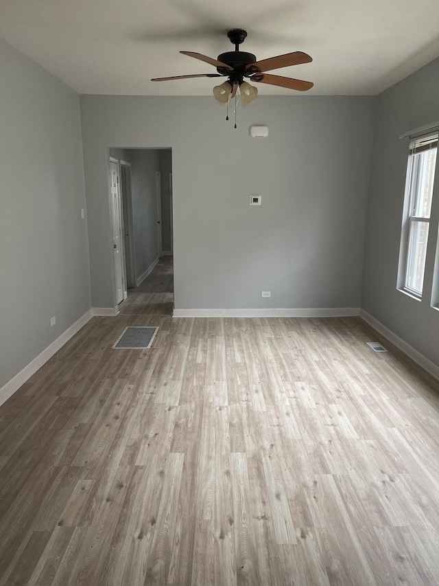 7535 S Vernon Ave, Chicago, IL 60619 - unfurnished room with a ceiling fan and wood finished floors
