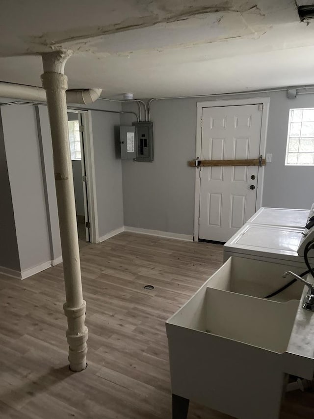 7535 S Vernon Ave, Chicago, IL 60619 - basement featuring electric panel, wood finished floors, and washing machine and dryer
