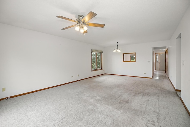 947 Winter Park Dr Unit 947, New Lenox, IL 60451 - spare room with light carpet, ceiling fan, and a chandelier