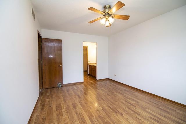 947 Winter Park Dr Unit 947, New Lenox, IL 60451 - unfurnished bedroom featuring wood finished floors and connected bathroom
