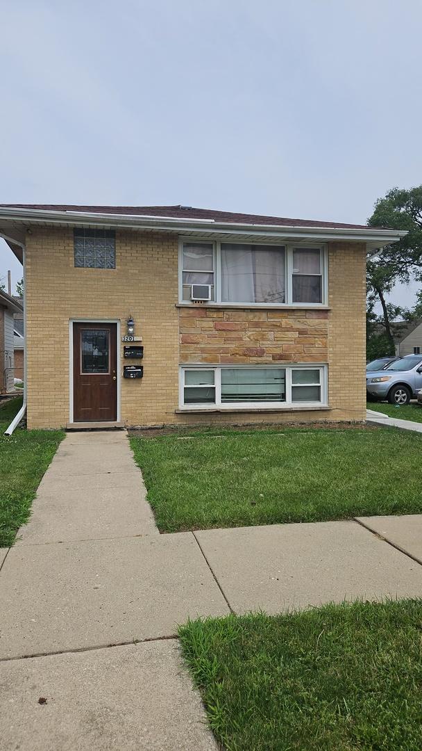 3201 Armitage Ave, Melrose Park, IL 60160 - view of front of house with a front lawn and brick siding